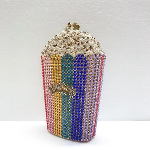Detailed close-up of rainbow crystal popcorn bucket clutch with gold-tone hardware