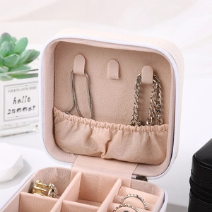 Portable PU leather jewelry organizer in beige for rings and necklaces with plush lining