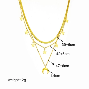 Three-layer gold titanium steel chain necklace with moon and star pendants on white background