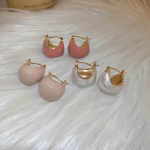 Three pairs of vintage gold-plated hoop earrings with glossy colorful enamel glaze