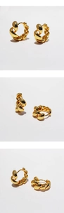 Detailed view of twisted rope texture on these polished gold hoop earrings for women