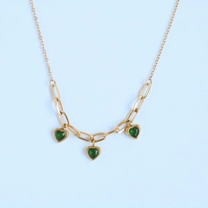 Gold chain necklace featuring three green heart charms made of stainless steel