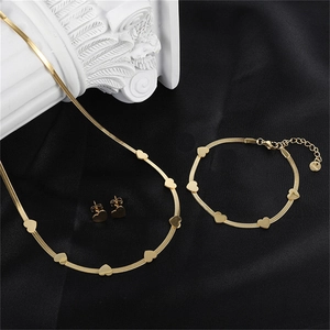 Detailed view of 18k gold plated stainless steel jewelry set with heart snake chains