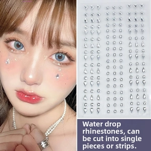 Detailed view of teardrop face jewels for sparkling makeup and music festival facial decor