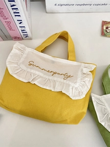 Yellow canvas lunch tote with Summerparty embroidery and sweet ruffle decorative edges