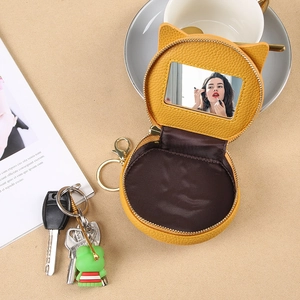 Mini yellow cat-ear leather makeup bag with built-in mirror and gold keychain