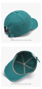 Detail of teal washed cotton baseball cap showing frayed holes and metal strap buckle