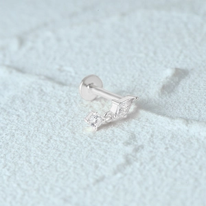 Detailed macro view of S925 silver flat back ear stud with sparkling crystal pendants