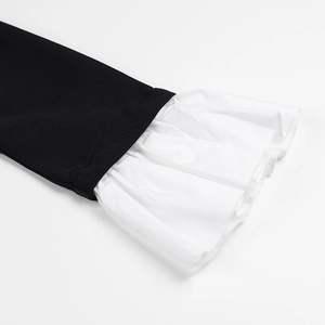 Detail of contrast ruffle cuffs on long sleeve button-up A-line shirt dress