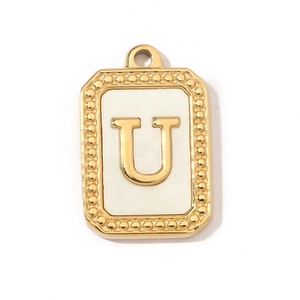 Detail showing letter U rectangle pendant with golden frame and white shell texture