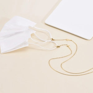 Minimalist gold titanium cross chain for masks featuring lobster clasps and pendants