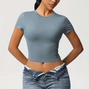 Detail of slim fit athletic crop top in morandi grey-blue with elastic fabric
