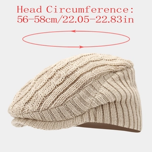 Detail of beige cable knit beret showing heavy texture and 56-58cm head size