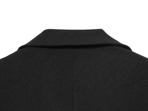 Close-up of the back collar detail on a tailored black blazer with fine twill texture