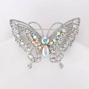 Detailed macro view of retro butterfly brooch with colorful AB rhinestones and silver plating