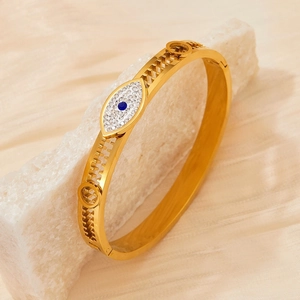 Gold stainless steel evil eye cuff bracelet with sparkling cubic zirconia accents
