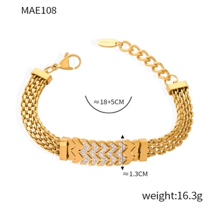 Detailed view of 18k gold plated stainless steel chain bracelet with diamond letter W link