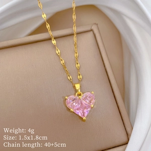 Macro detail of gold necklace with pink heart pendant and size parameters on soft background