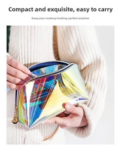 Close-up of holographic TPU cosmetic bag with metal zipper held by a person