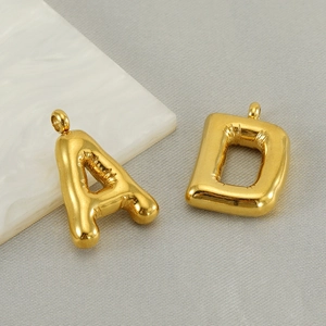 Polished gold bubble letter A and D necklaces with puffy balloon texture effect