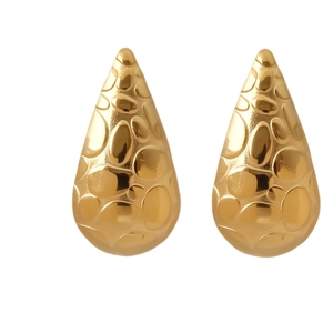 Textured gold teardrop earrings in 18K gold-plated stainless steel with fluid metal finish