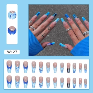 Blue long trapezoid press on nails set with heart, cloud, and checkerboard designs