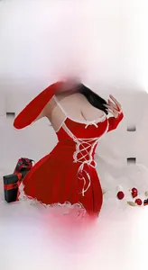 Detail view of red velvet Christmas lingerie set with lace trim and festive gift box