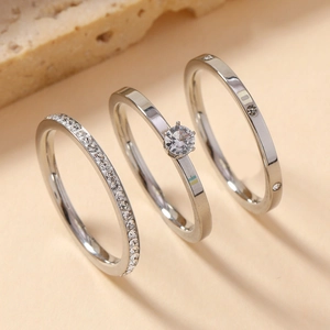 Three-piece silver stainless steel ring set featuring pavé and solitaire crystals