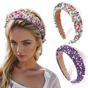 Fashion baroque headband with colorful rhinestones and purple gemstones on a white background