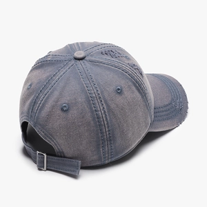 Vintage washed denim baseball cap with distressed details and adjustable metal buckle back