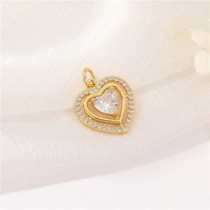 Detail of a rotating heart pendant with sparkling crystals on white fabric