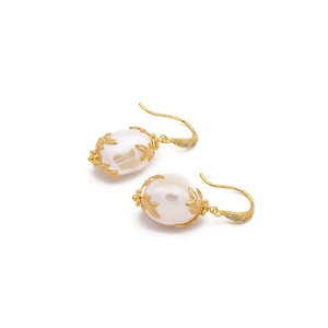 Baroque pearl earrings with golden leaf design and zircon stones for a vintage elegant look