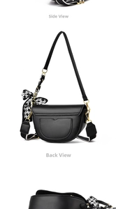 Detail view of black vintage saddle bag showing back pocket and checkerboard bow detail