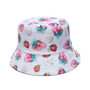 Close-up of strawberry and floral watercolor print on a white cotton sun hat for women
