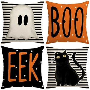 Halloween pillow covers with black cat, ghost, and BOO patterns on striped linen fabric