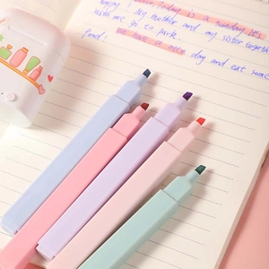 5-pack pastel chisel tip highlighters with square anti-roll barrels on a notebook