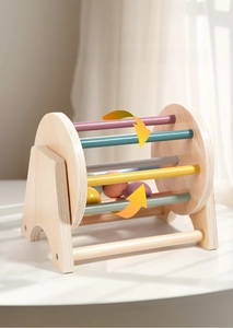 Close-up of wooden spinning drum toy with Morandi colored bars for sensory early education