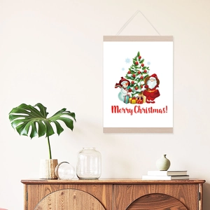 Detail view of a Christmas wall art with wooden scroll hanger on a cozy beige wall