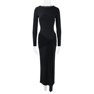 Detail of slim fit black maxi dress featuring waist knot ruching and side ribbon decor
