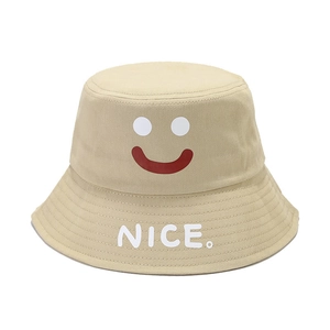 Minimalist beige bucket hat with a smile graphic and NICE. text for sun protection