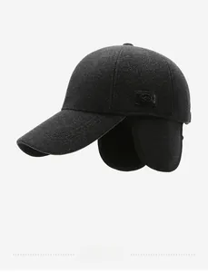 Detail view of winter baseball cap with ear flaps and wool blend fabric texture