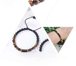 Detail of Morse code bracelet featuring natural tiger eye and matte agate stones with gift card