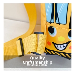 Close-up of yellow cartoon car chest bag showing woven strap and durable buckle details