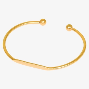 Detailed view of 18k gold plated stainless steel open bangle with spherical ends