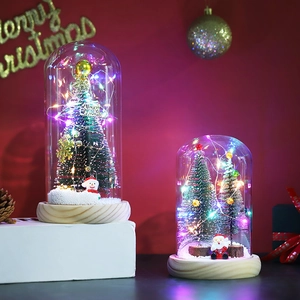 Christmas tree glass dome with LED lights and snowmen figures on a wooden base