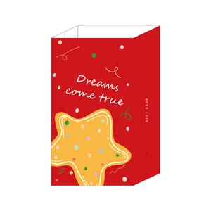 Red Christmas paper gift bag with yellow stars and Dreams Come True text on white background