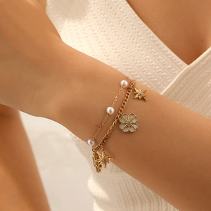 Gold-tone layered bracelet with white camellia charm, pearl and star pendant for women