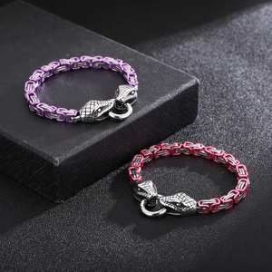 Close-up of Byzantine hip-hop snake head bracelets in purple and rose red metallic finish