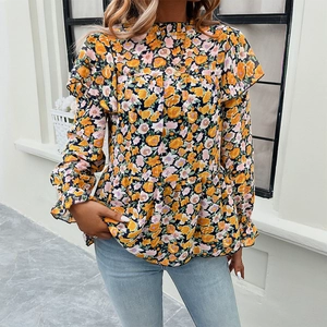 Floral long sleeve blouse with ruffle cuffs and peplum hem in black and yellow print