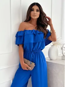 Close-up of royal blue off-shoulder jumpsuit with ruffled neckline and drawstring waist